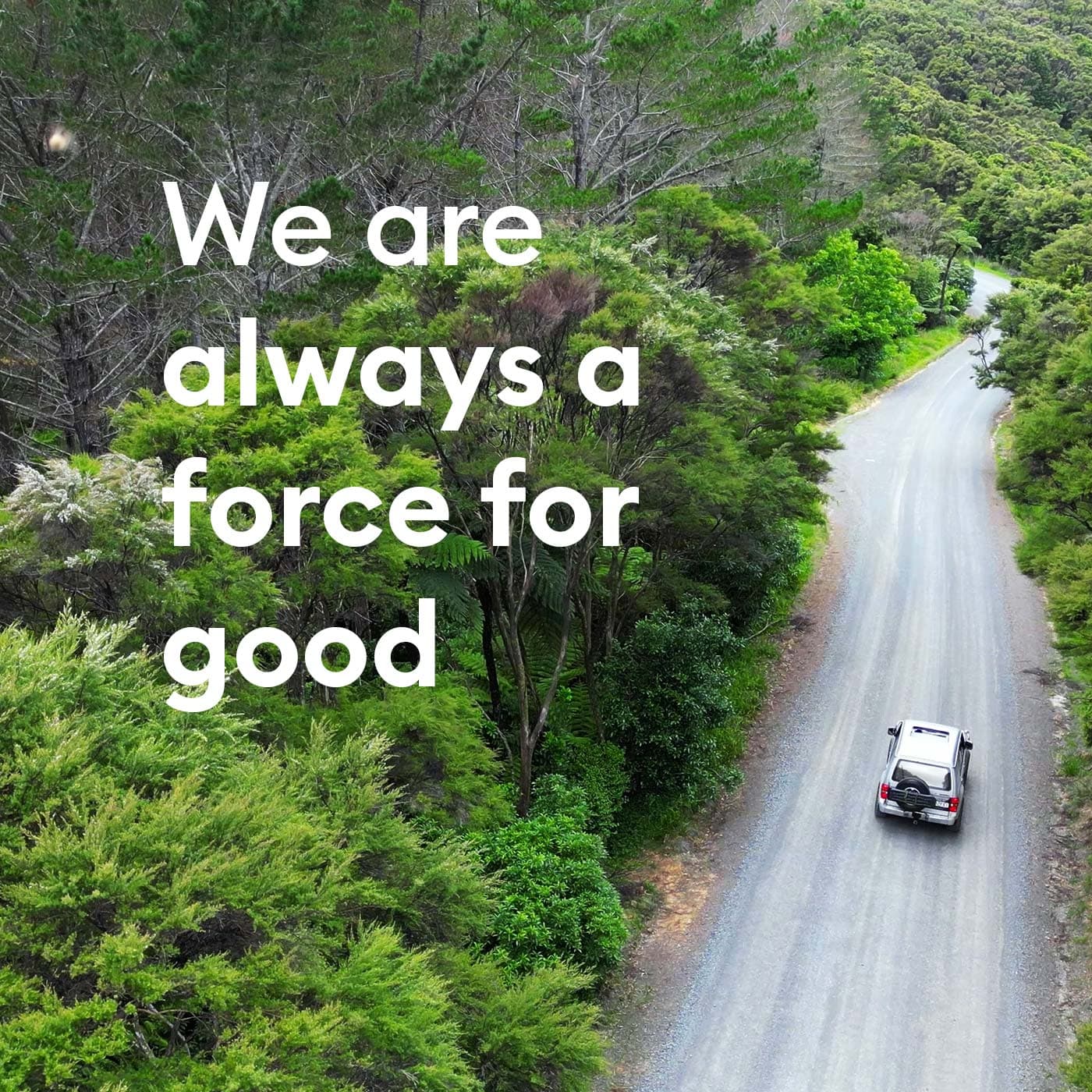 We are always a force for good. Photo: An aerial view of an SUV driving on the road through Pajero forest. New Zealand. We are always a force for good. Photo: An aerial view of an SUV driving on the road through Pajero forest. New Zealand.