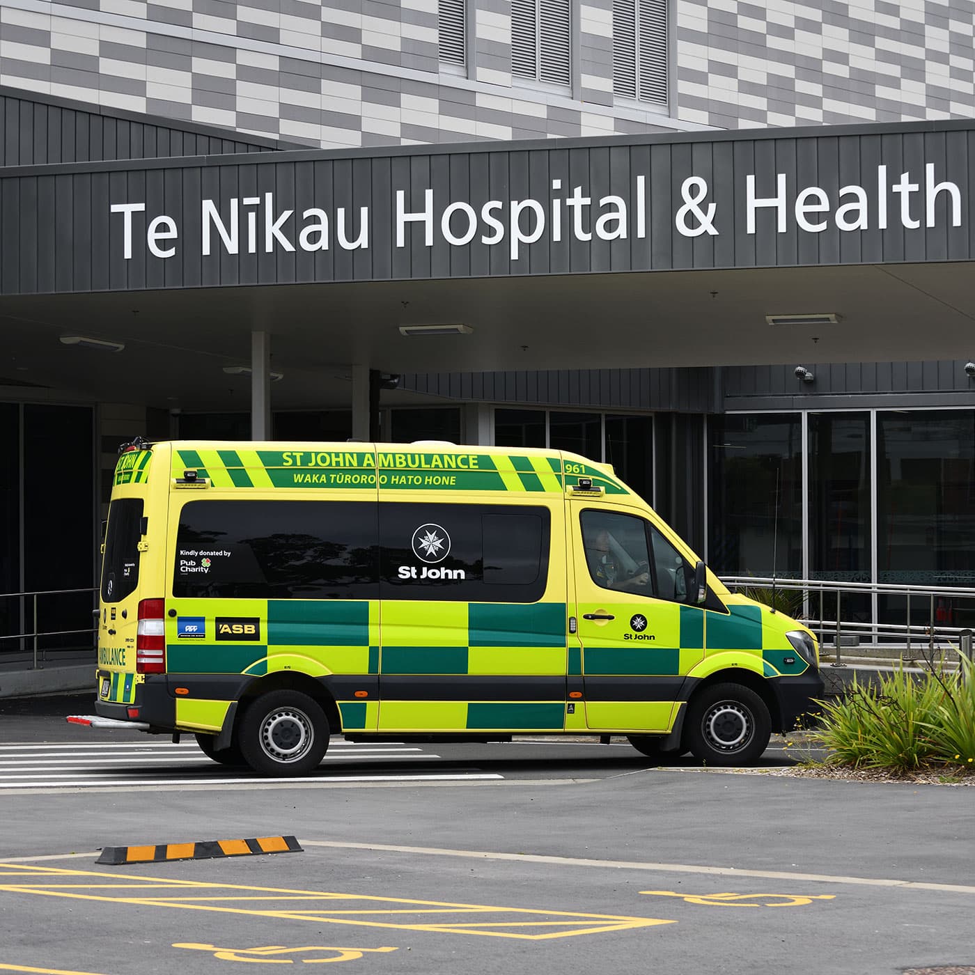 An ambulance drives past the entrance to the newly opened Te Nikau Hospital and Health Centre in Greymouth, New Zealand. An ambulance drives past the entrance to the newly opened Te Nikau Hospital and Health Centre in Greymouth, New Zealand.
