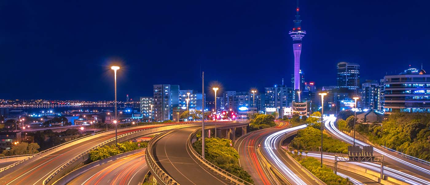 Night traffic view of Auckland city centre on the horizon, New Zealand Night traffic view of Auckland city centre on the horizon, New Zealand